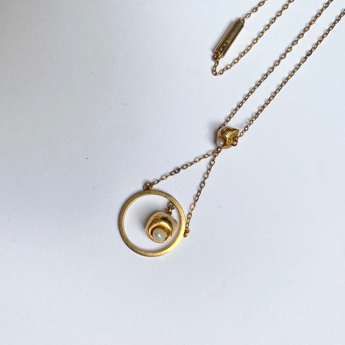 A very pretty antique early 20th century seed pearl and double drop pendant, with chain
