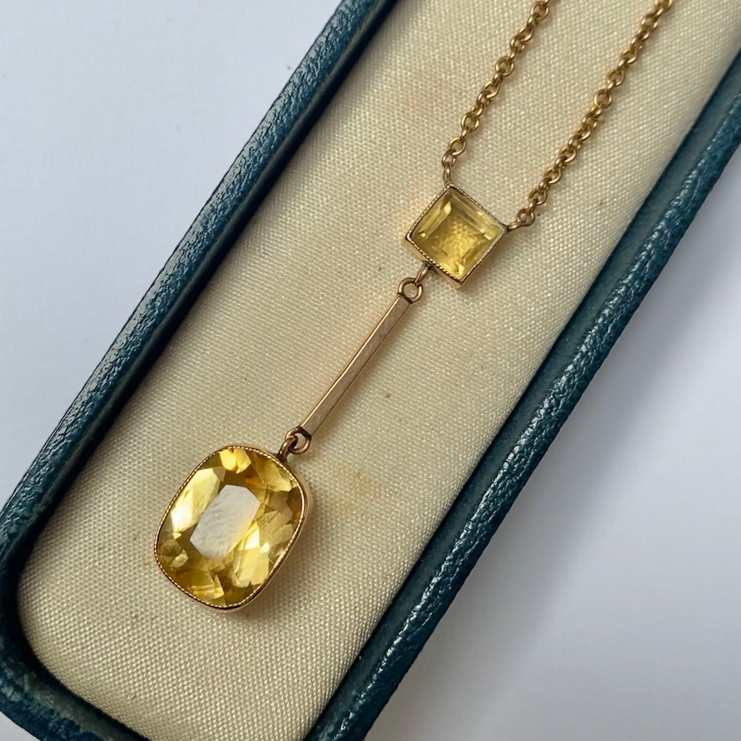 An Edwardian 9ct gold citrine pendant, with integral chain.