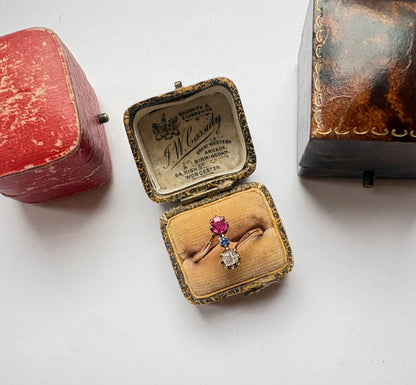 Early 20th century gold diamond, ruby and sapphire three-stone ring