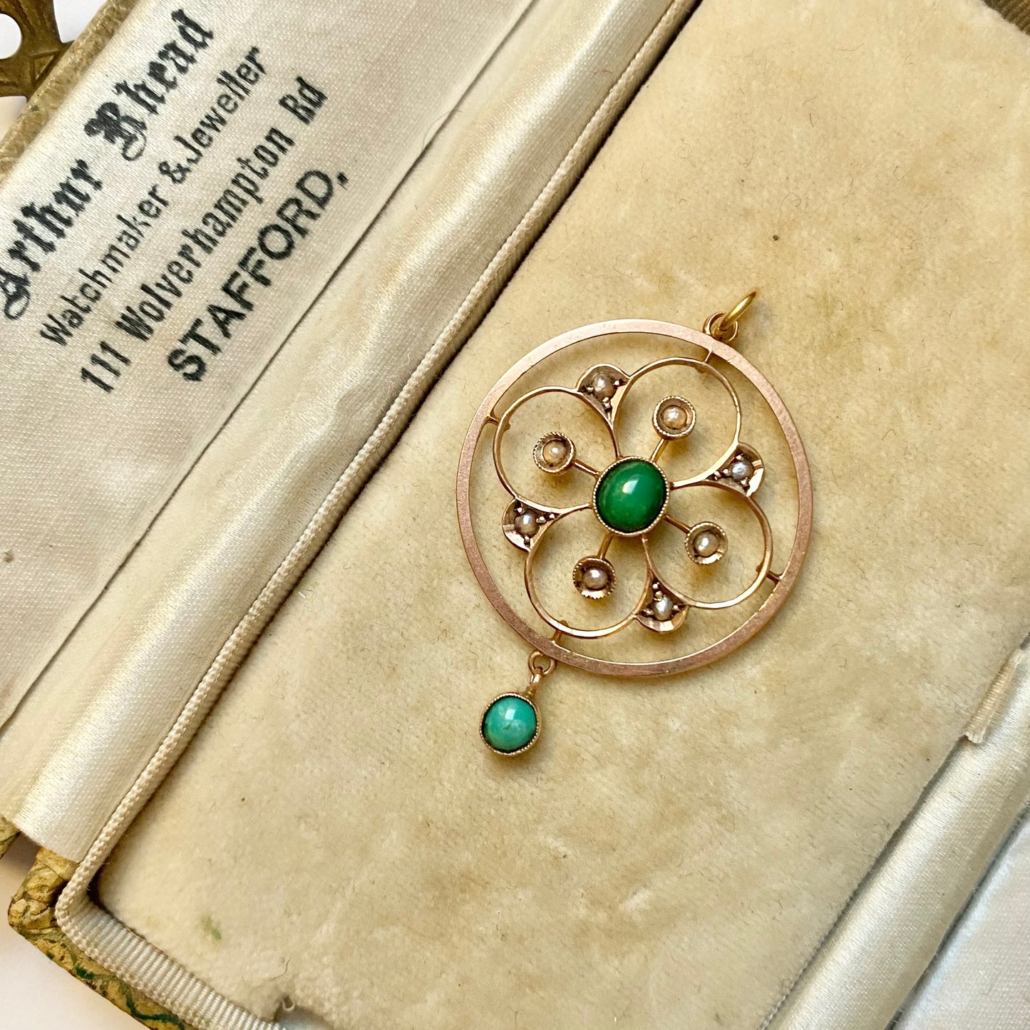 A very pretty antique early 20th century Edwardian split pearl and turquoise openwork floral pendant