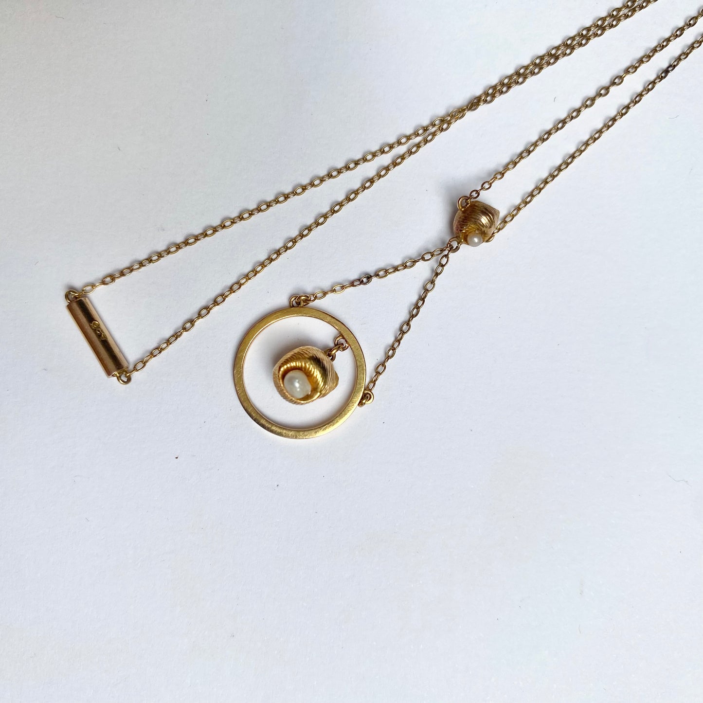A very pretty antique early 20th century seed pearl and double drop  pendant, with chain