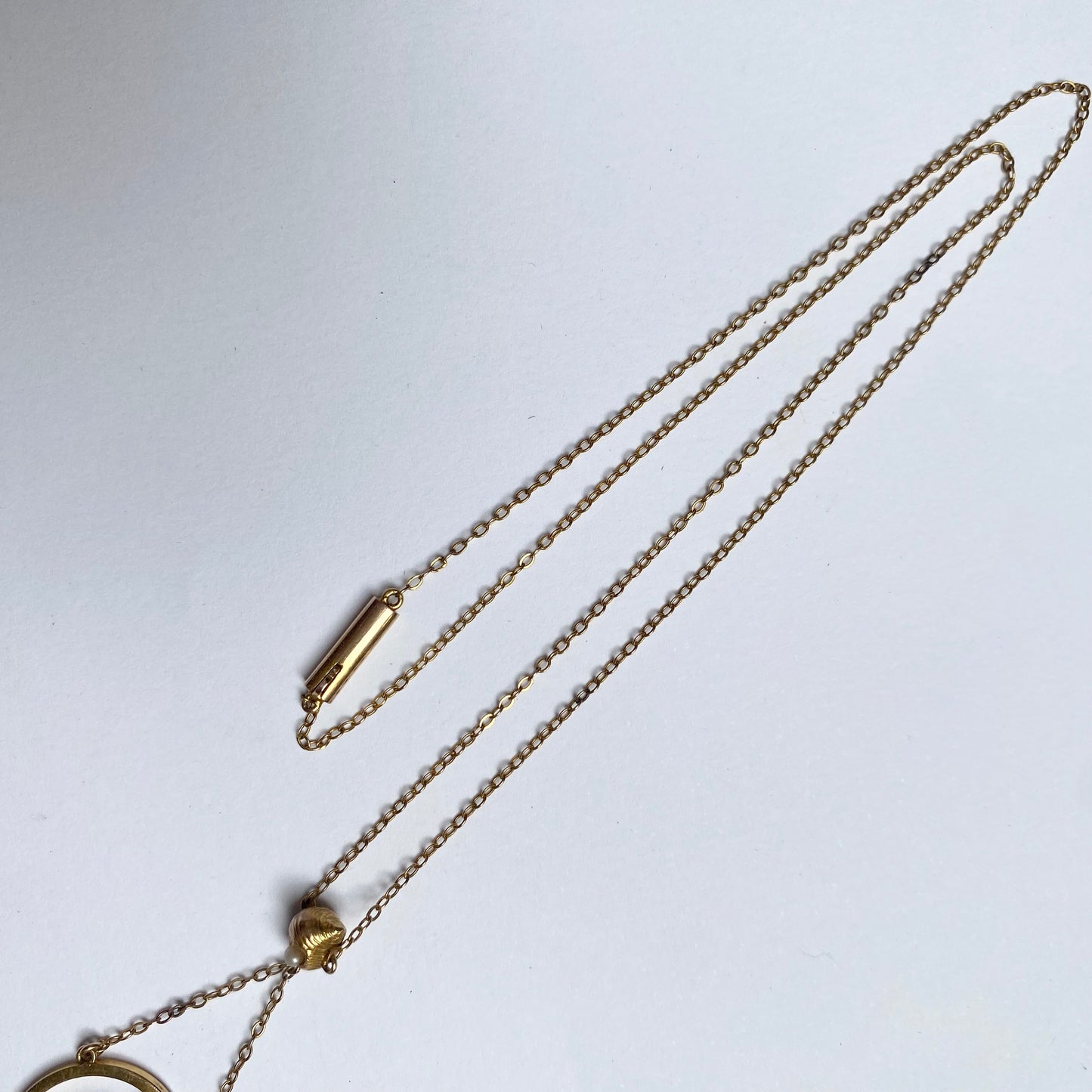 A very pretty antique early 20th century seed pearl and double drop  pendant, with chain