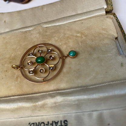 A very pretty antique early 20th century Edwardian split pearl and turquoise openwork floral pendant