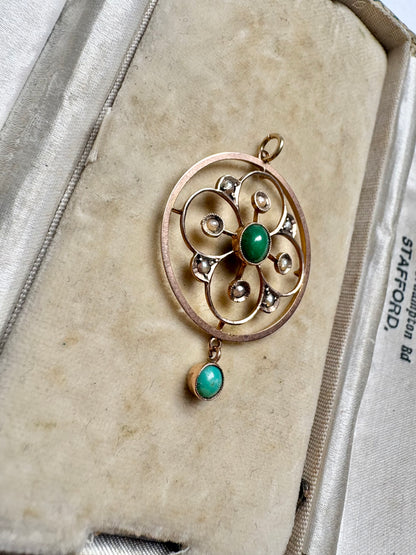 A very pretty antique early 20th century Edwardian split pearl and turquoise openwork floral pendant