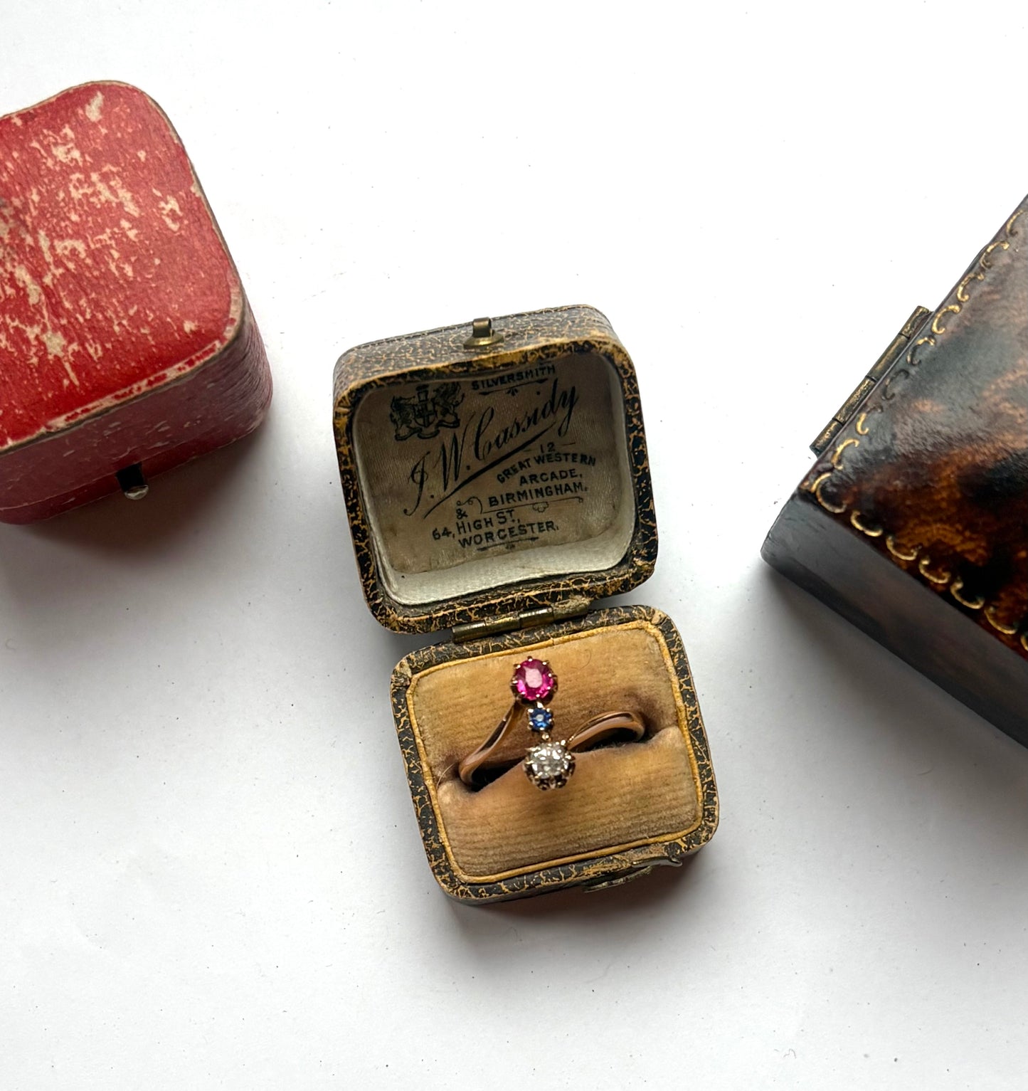 Early 20th century gold diamond, ruby and sapphire three-stone ring