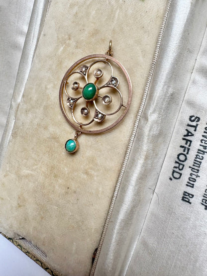 A very pretty antique early 20th century Edwardian split pearl and turquoise openwork floral pendant