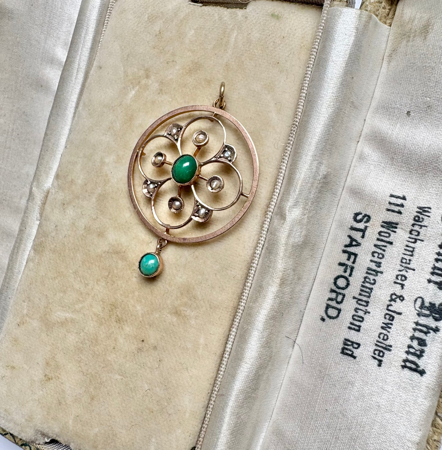A very pretty antique early 20th century Edwardian split pearl and turquoise openwork floral pendant