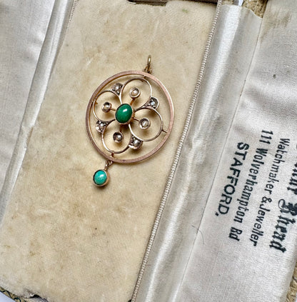 A very pretty antique early 20th century Edwardian split pearl and turquoise openwork floral pendant