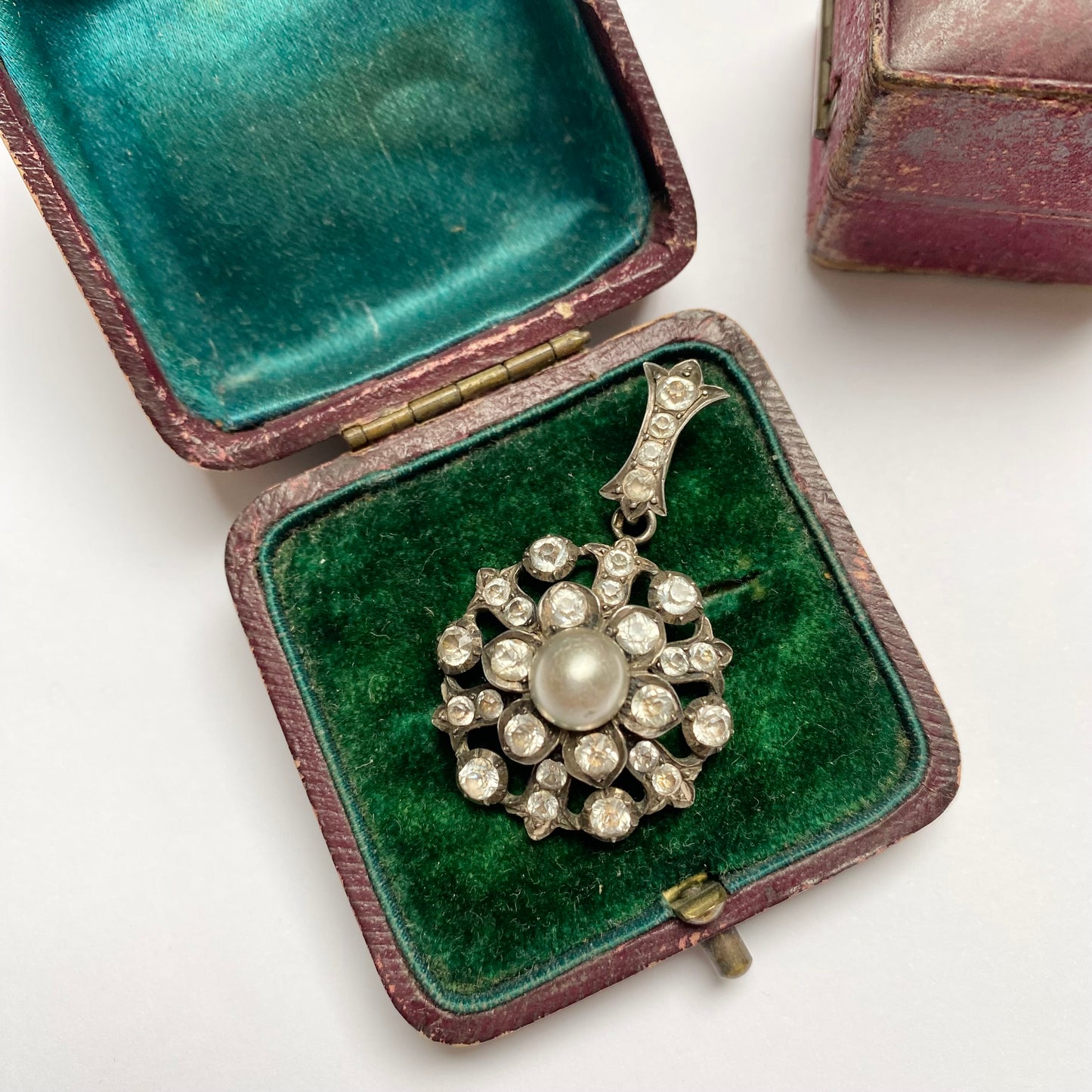 Antique early 20th century silver, colourless paste and imitation pearl cluster pendant.