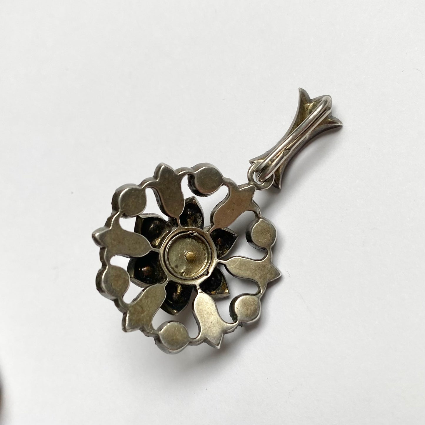 Antique early 20th century silver, colourless paste and imitation pearl cluster pendant.