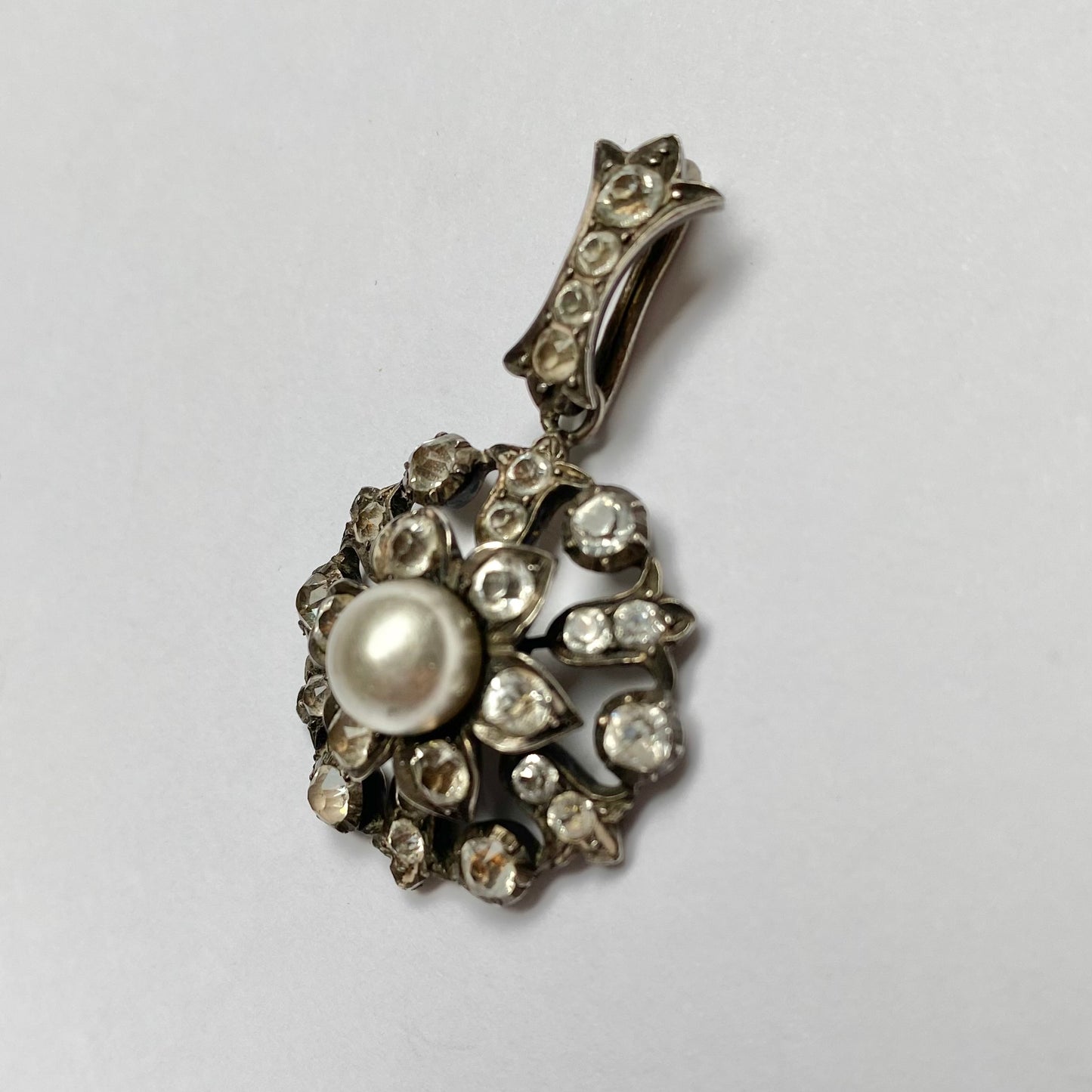 Antique early 20th century silver, colourless paste and imitation pearl cluster pendant.