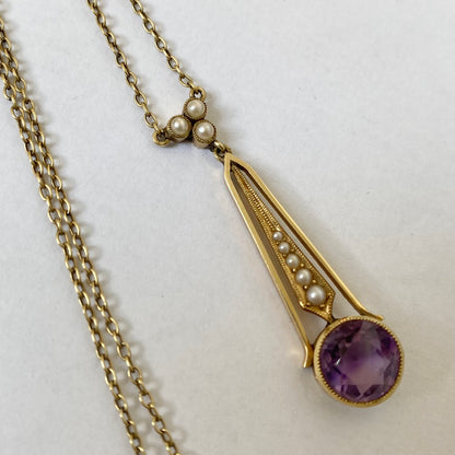 An Edwaridan 15ct gold amethyst and split pearl pendant, with integral chain.