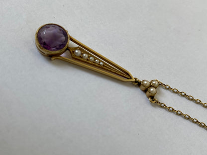 An Edwaridan 15ct gold amethyst and split pearl pendant, with integral chain.