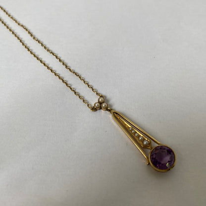 An Edwaridan 15ct gold amethyst and split pearl pendant, with integral chain.