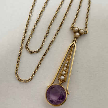An Edwaridan 15ct gold amethyst and split pearl pendant, with integral chain.