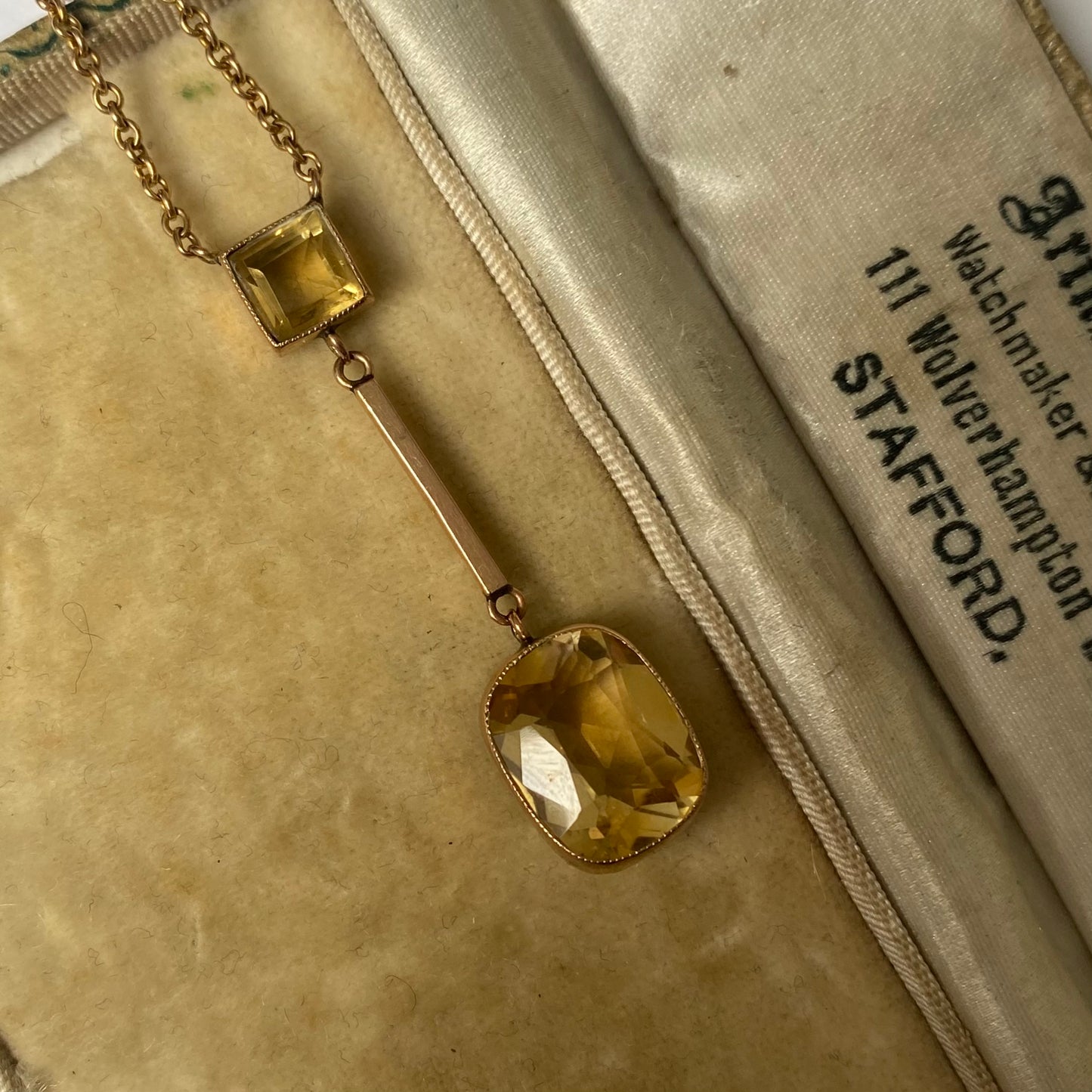 An Edwardian 9ct gold citrine pendant, with integral chain.