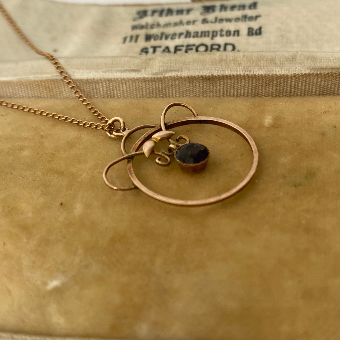An Art Nouveau gold amethyst pendant, with chain.