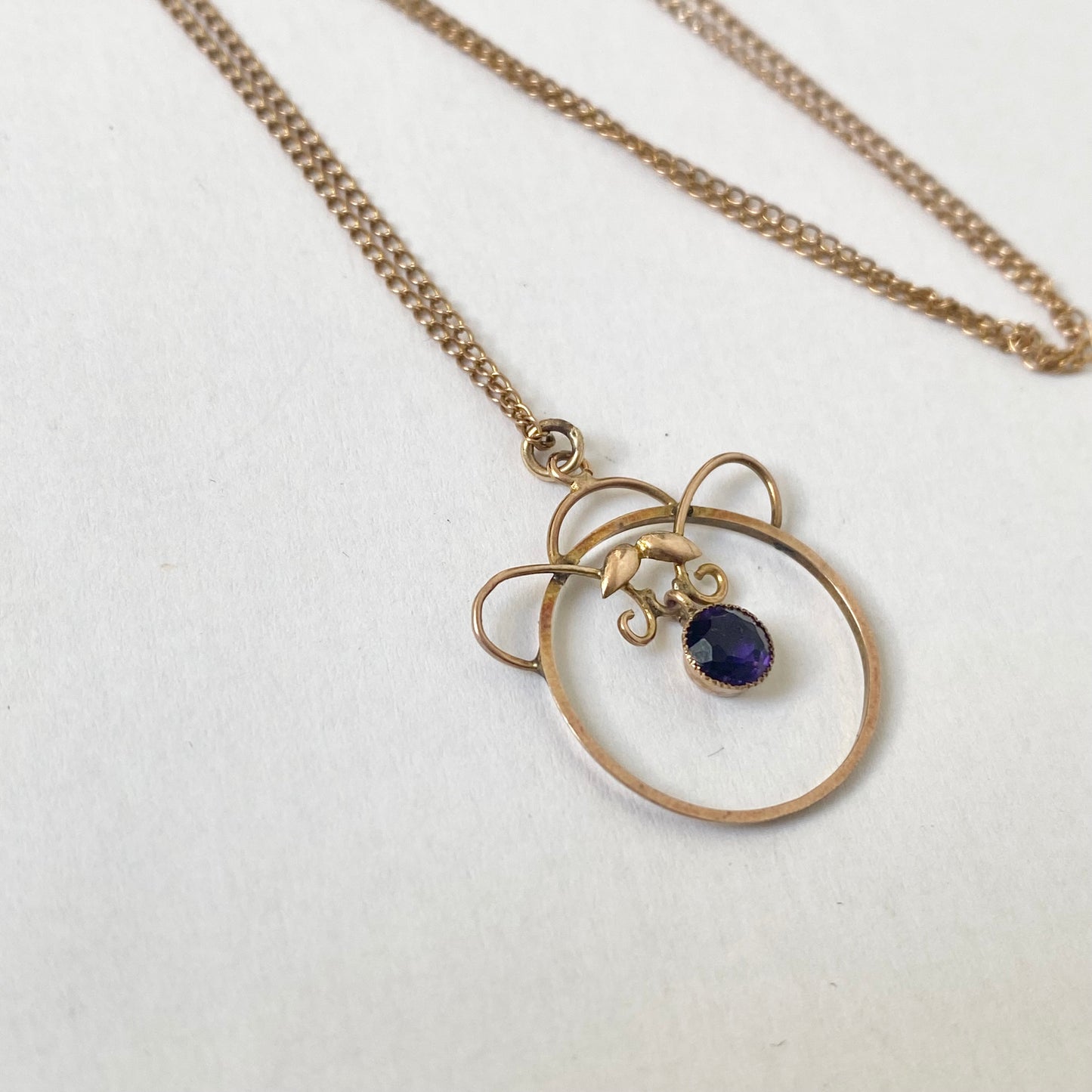 An Art Nouveau gold amethyst pendant, with chain.