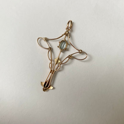 An Art Nouveau gold topaz and split pearl pendant.