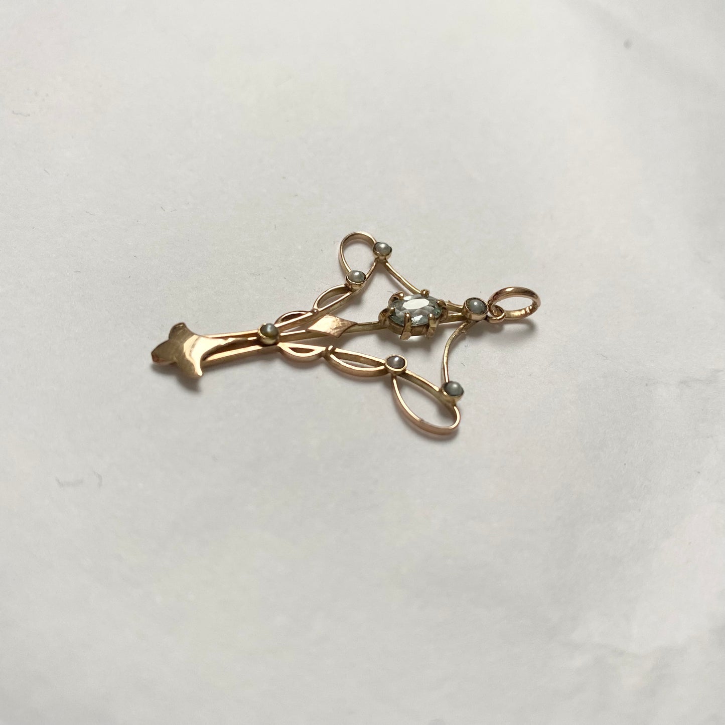 An Art Nouveau gold topaz and split pearl pendant.