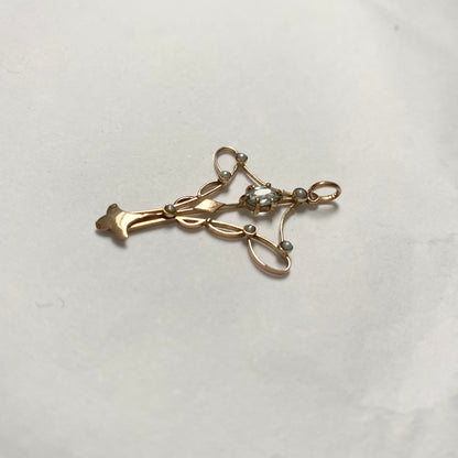An Art Nouveau gold topaz and split pearl pendant.