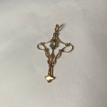 An Art Nouveau gold topaz and split pearl pendant.