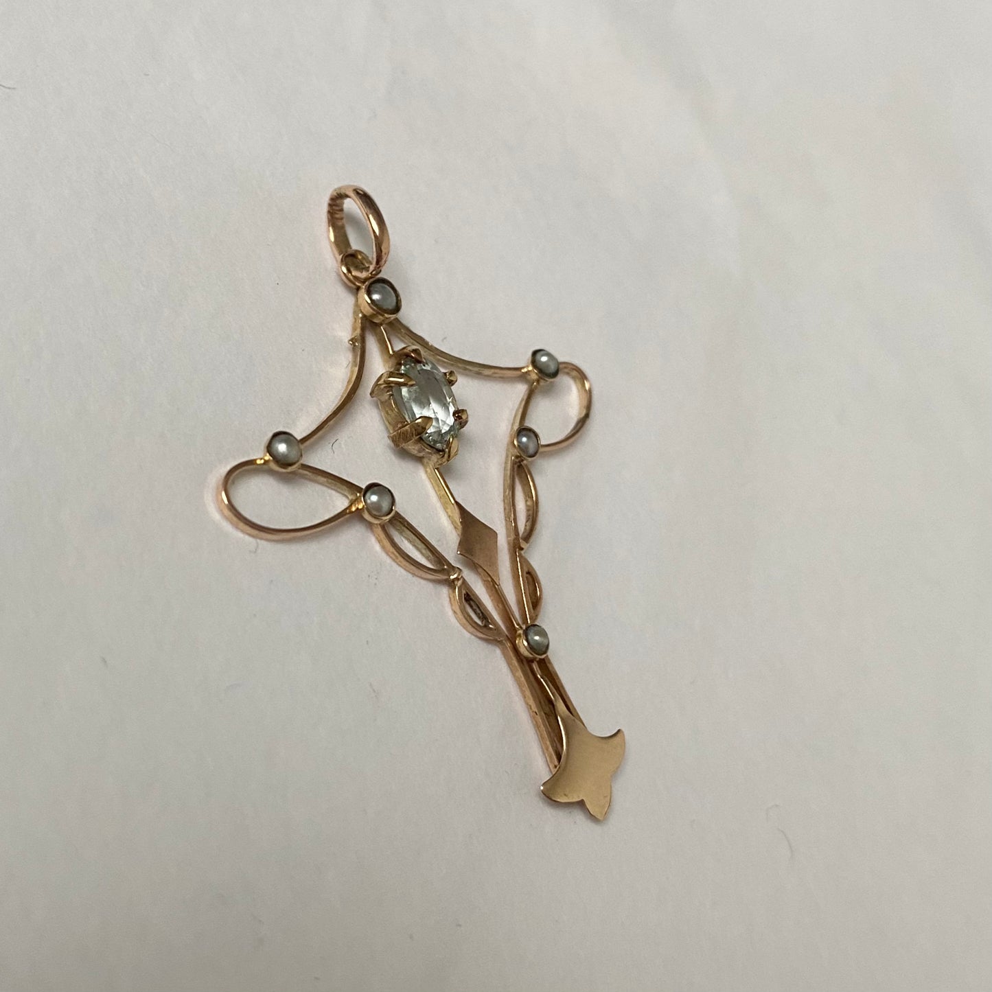 An Art Nouveau gold topaz and split pearl pendant.