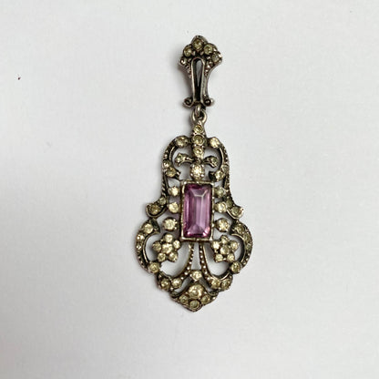 An early 20th century colourless and purple paste foliate pendant.