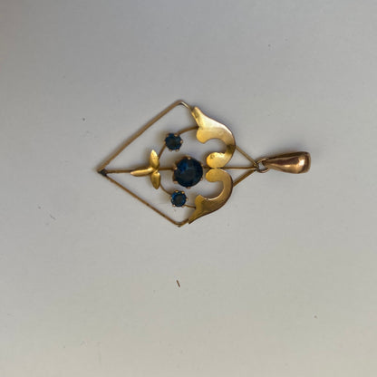 Early 20th century 9ct gold kite-shape pendant, set with sapphires.