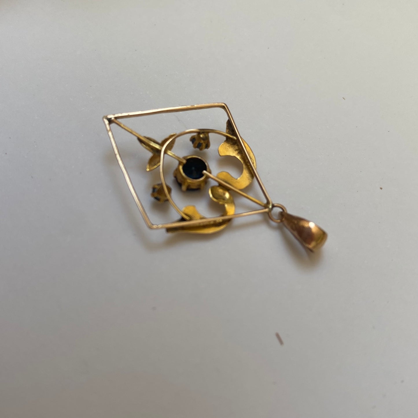 Early 20th century 9ct gold kite-shape pendant, set with sapphires.
