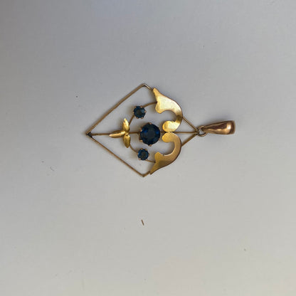 Early 20th century 9ct gold kite-shape pendant, set with sapphires.