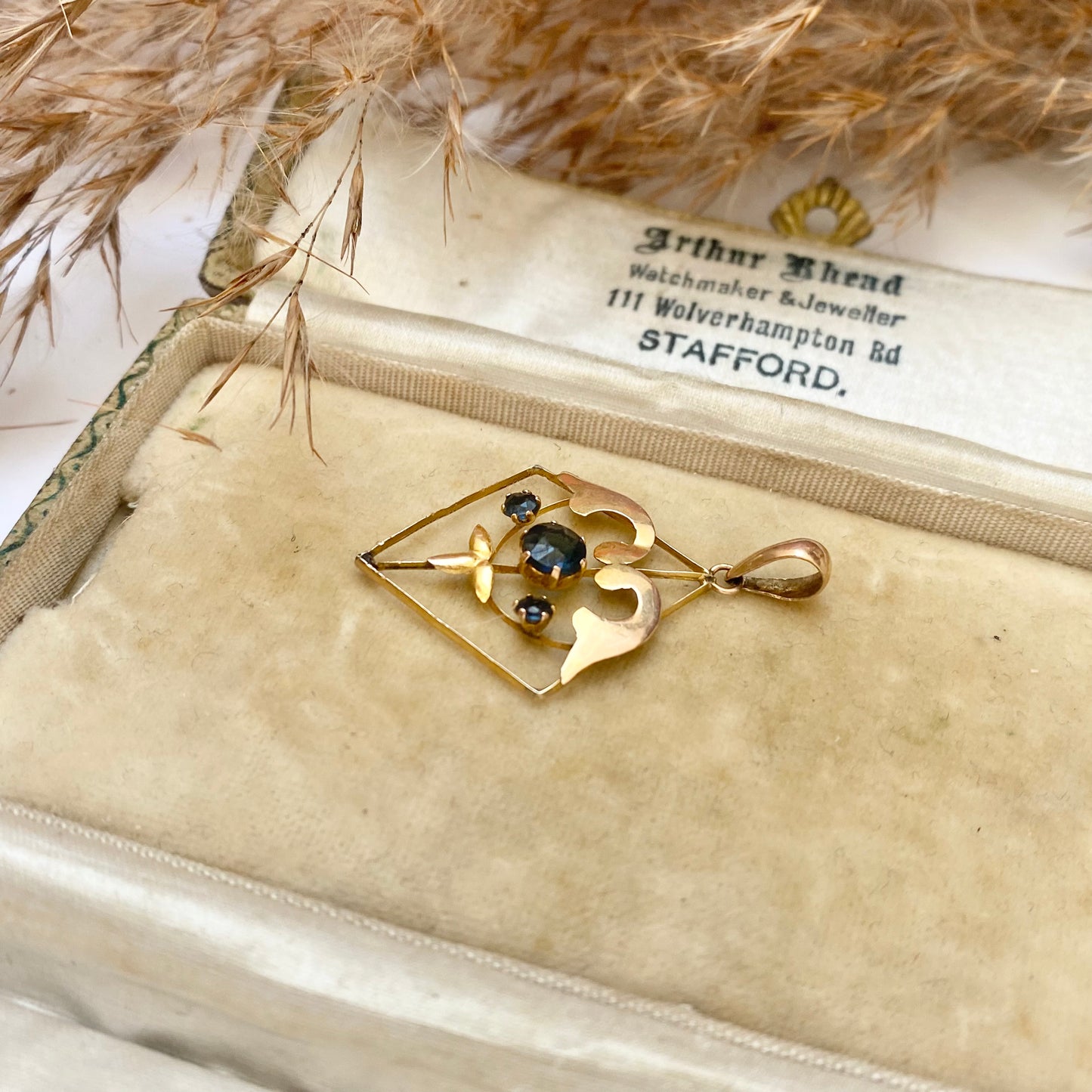 Early 20th century 9ct gold kite-shape pendant, set with sapphires.