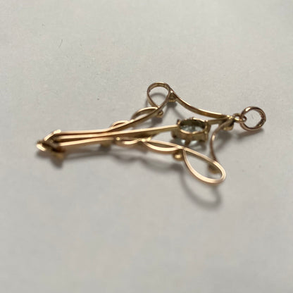An Art Nouveau gold topaz and split pearl pendant.