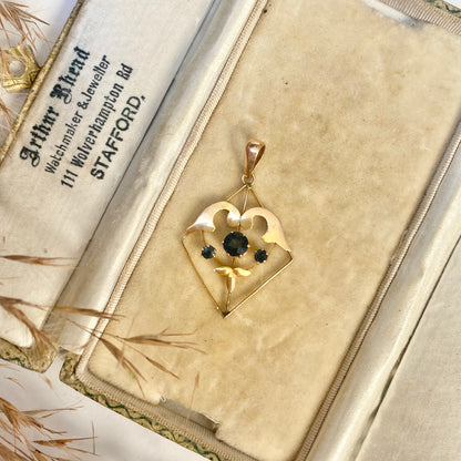Early 20th century 9ct gold kite-shape pendant, set with sapphires.