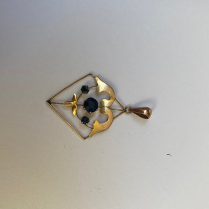 Early 20th century 9ct gold kite-shape pendant, set with sapphires.